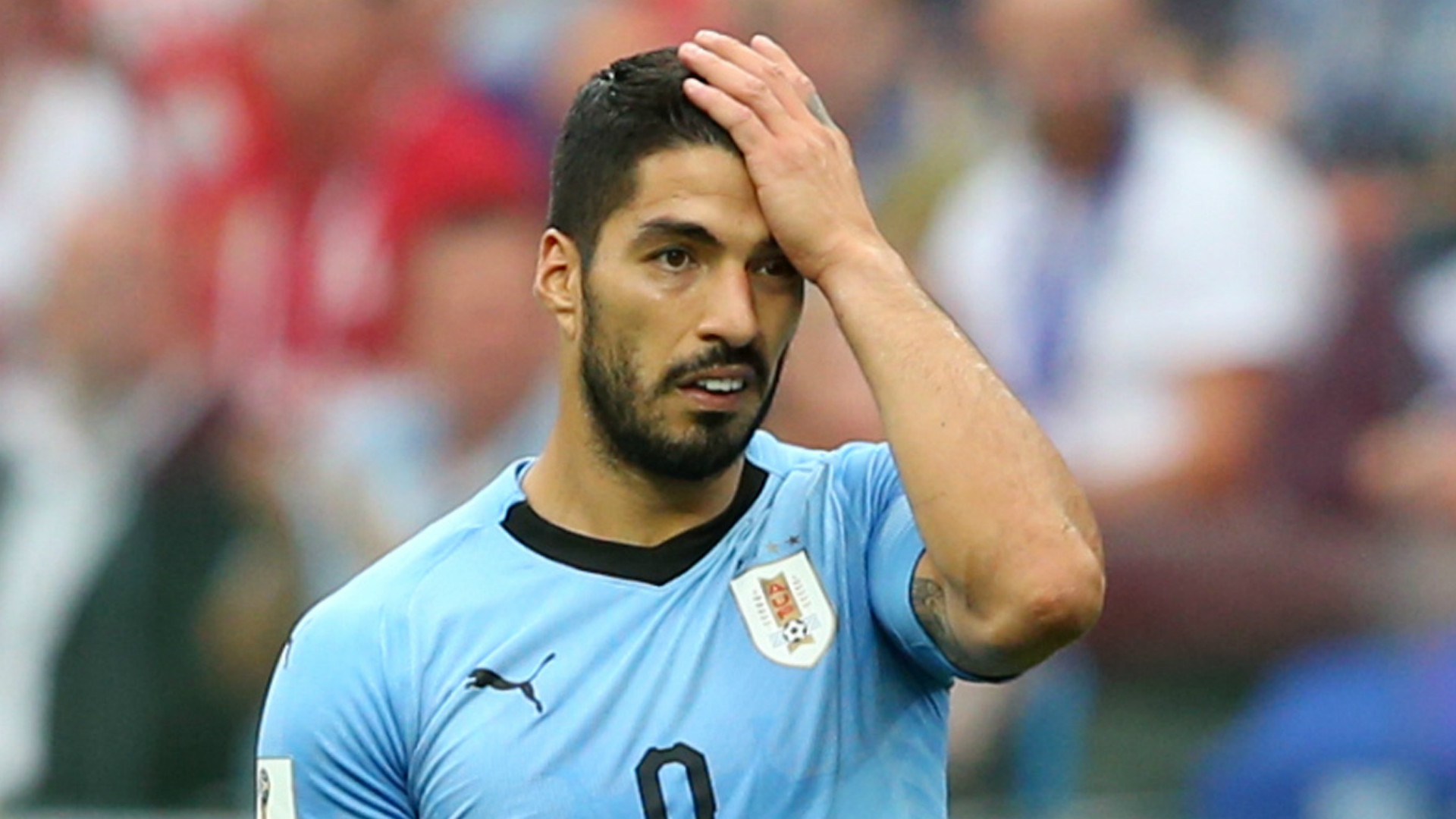 Sorry Suarez aims FIFA jibe as Uruguay stunned