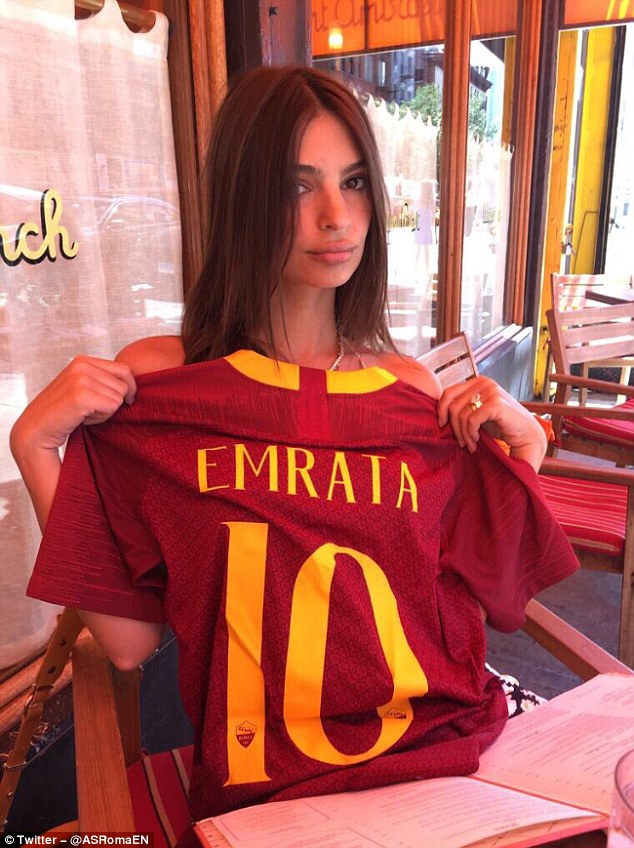 Emily Ratajkowski As Roma Emily Ratajkowski poses with Roma shirt as model looks to lift spirits ...