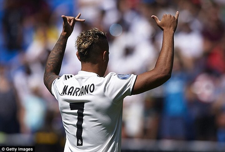 Mariano Diaz poses in a Real Madrid shirt after completing £30m move