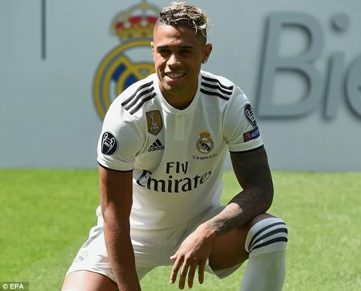 Mariano Diaz poses in a Real Madrid shirt after completing £30m move