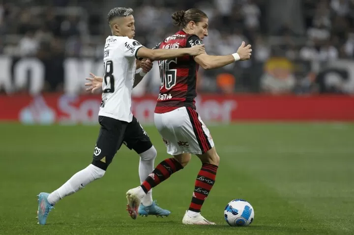 Gustavo Henrique of Brazil's Flamengo, top, heads the ball as