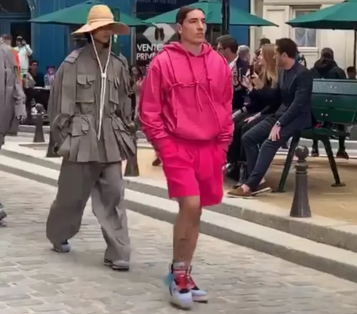 Hector Bellerin struts down the catwalk at Paris Fashion Week as he models  for Louis Vuitton