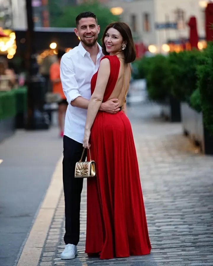 Jorginho's girlfriend Catherine joins no bra club in red dress in