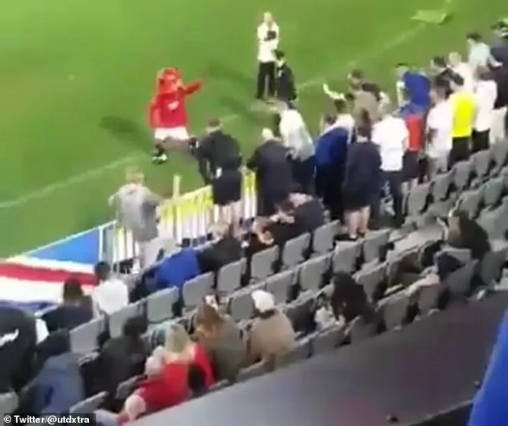 Man Utd Mascot Fred The Red Taunts Leeds Fans Before Being Doused In Beer All Football