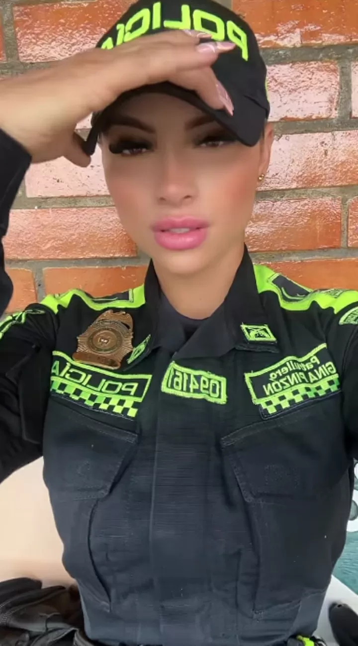 Glamorous police officer who went viral at football match poses braless|  All Football