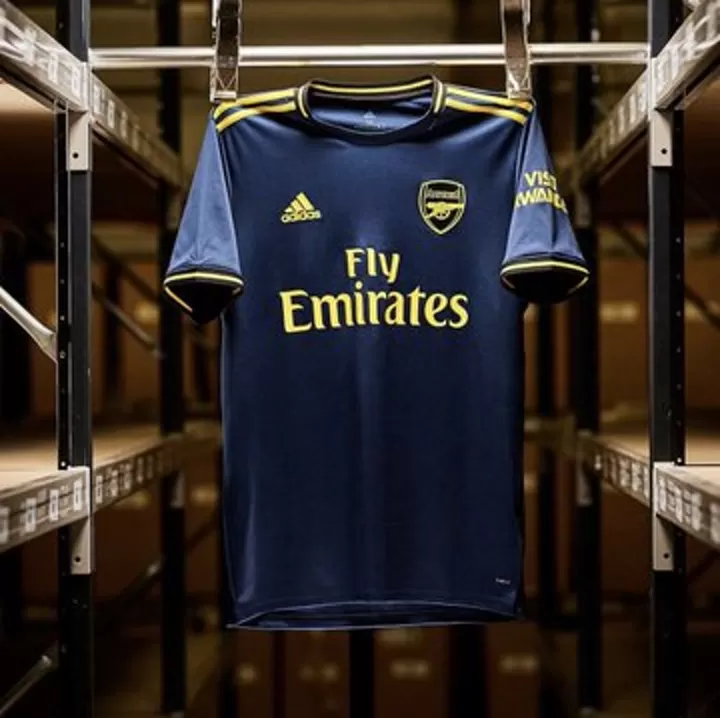Dark blue and gold Arsenal unveil their new stylish 3rd kit for
