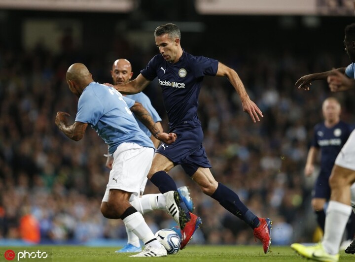 Manchester City Legend's and Premier League All Stars XI players hold up a  banner for the Tackle4MCR campaign prior to the beginning of the Vincent  Kompany Testimonial at the Etihad Stadium, Manchester