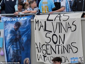 Argentina fans display 'Malvinas' banner in the stands at Messi's farewell match